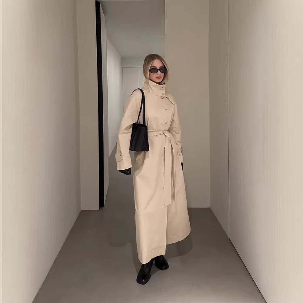 Ladies maxilength trench coat with high stand-up collar, double-breasted button placket and tie belt Chichicherry - Chichicherry