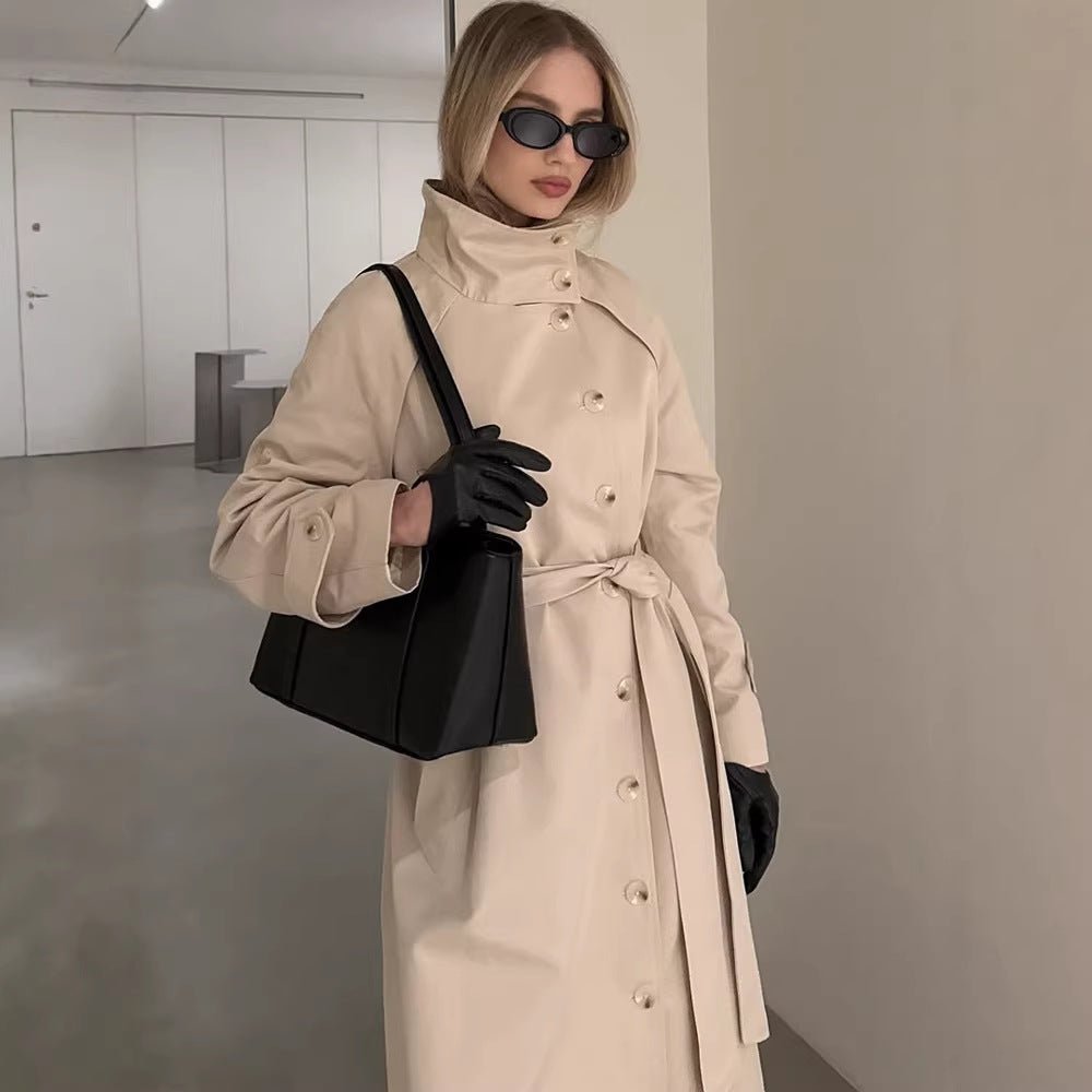 Ladies maxilength trench coat with high stand-up collar, double-breasted button placket and tie belt Chichicherry - Chichicherry