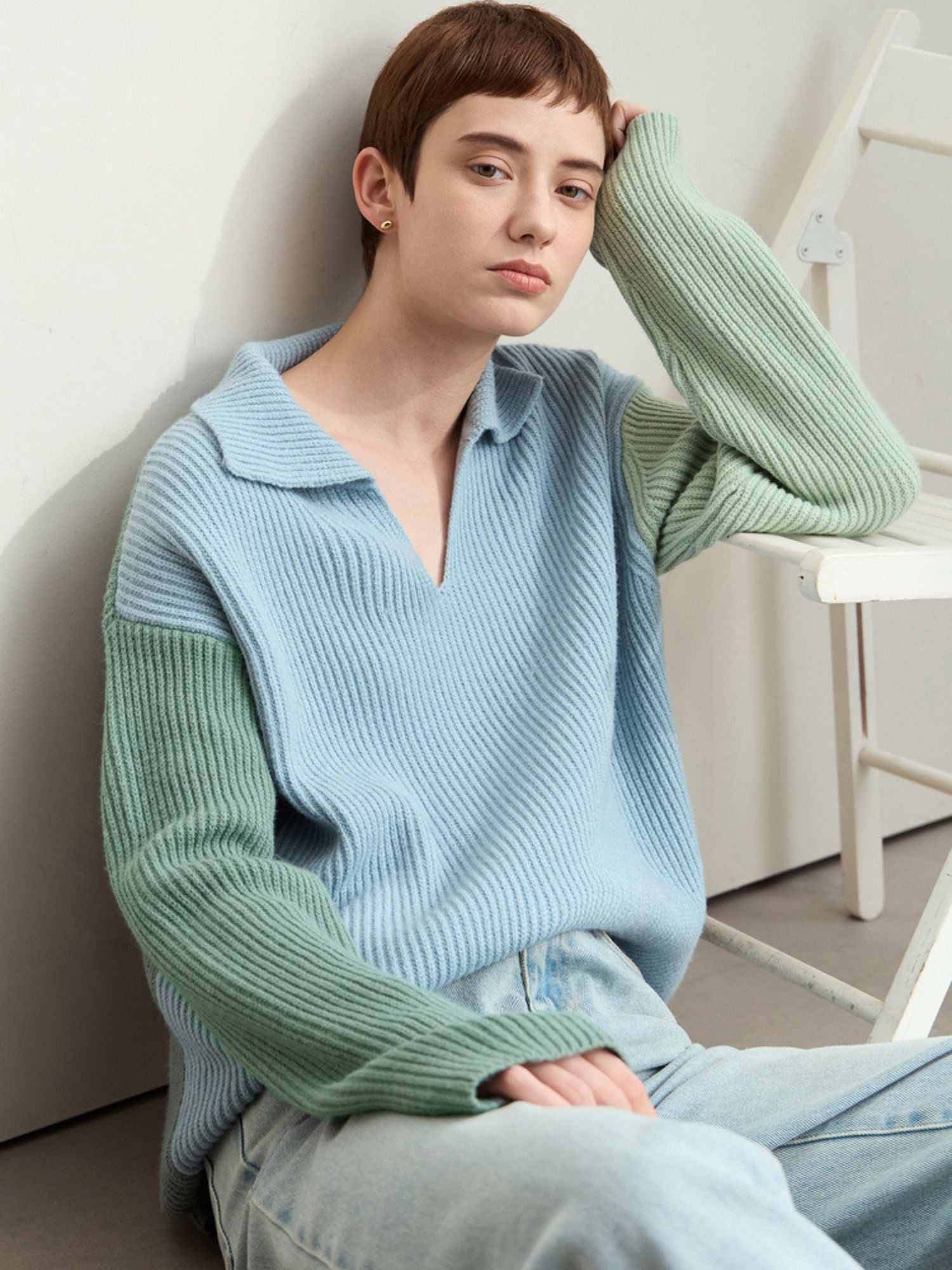 Front view of sweater flat-lay, featuring color-block knit in blue and mint