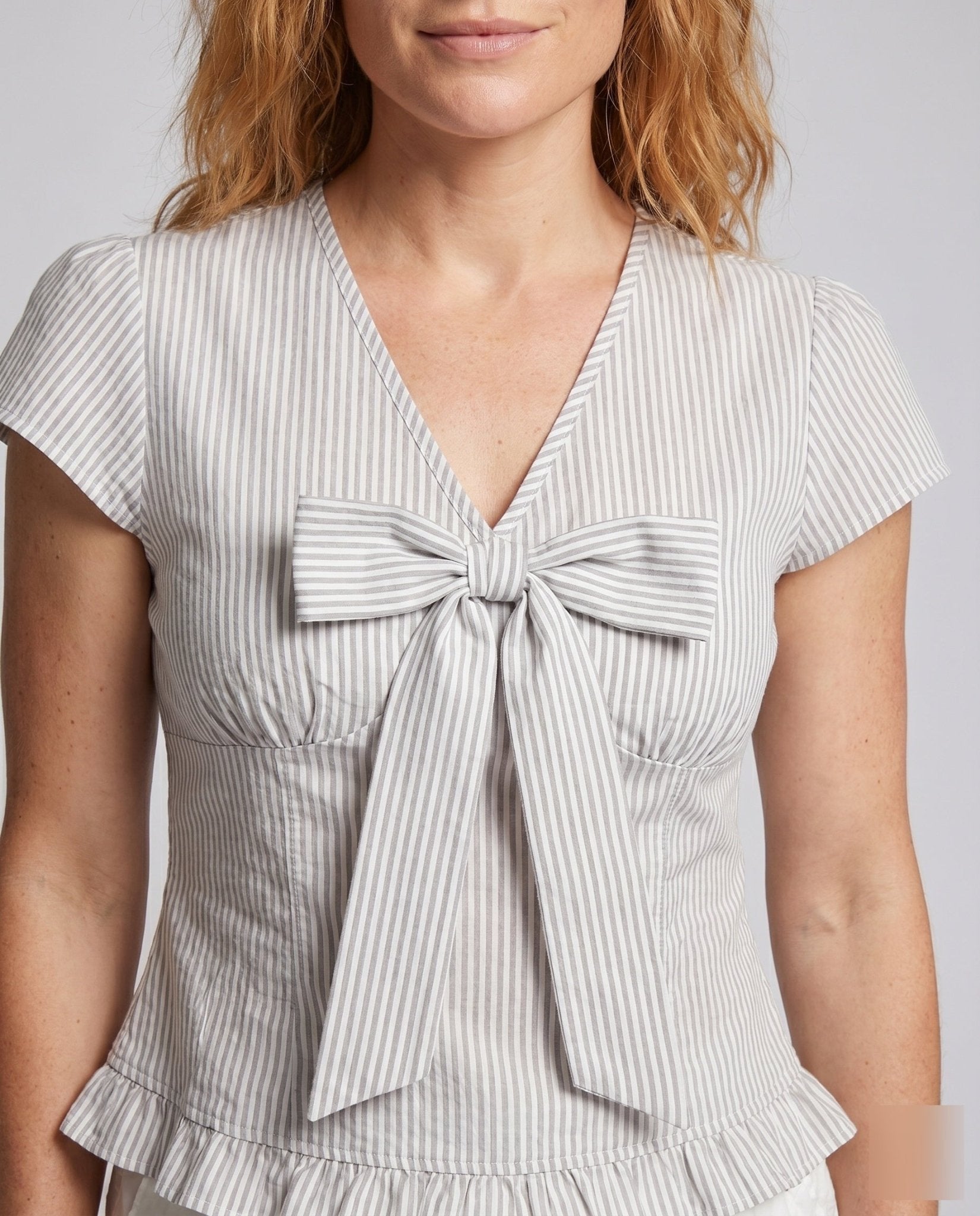 Women casual blouse shirt with ruffle details and playful bow accent - Chichicherry