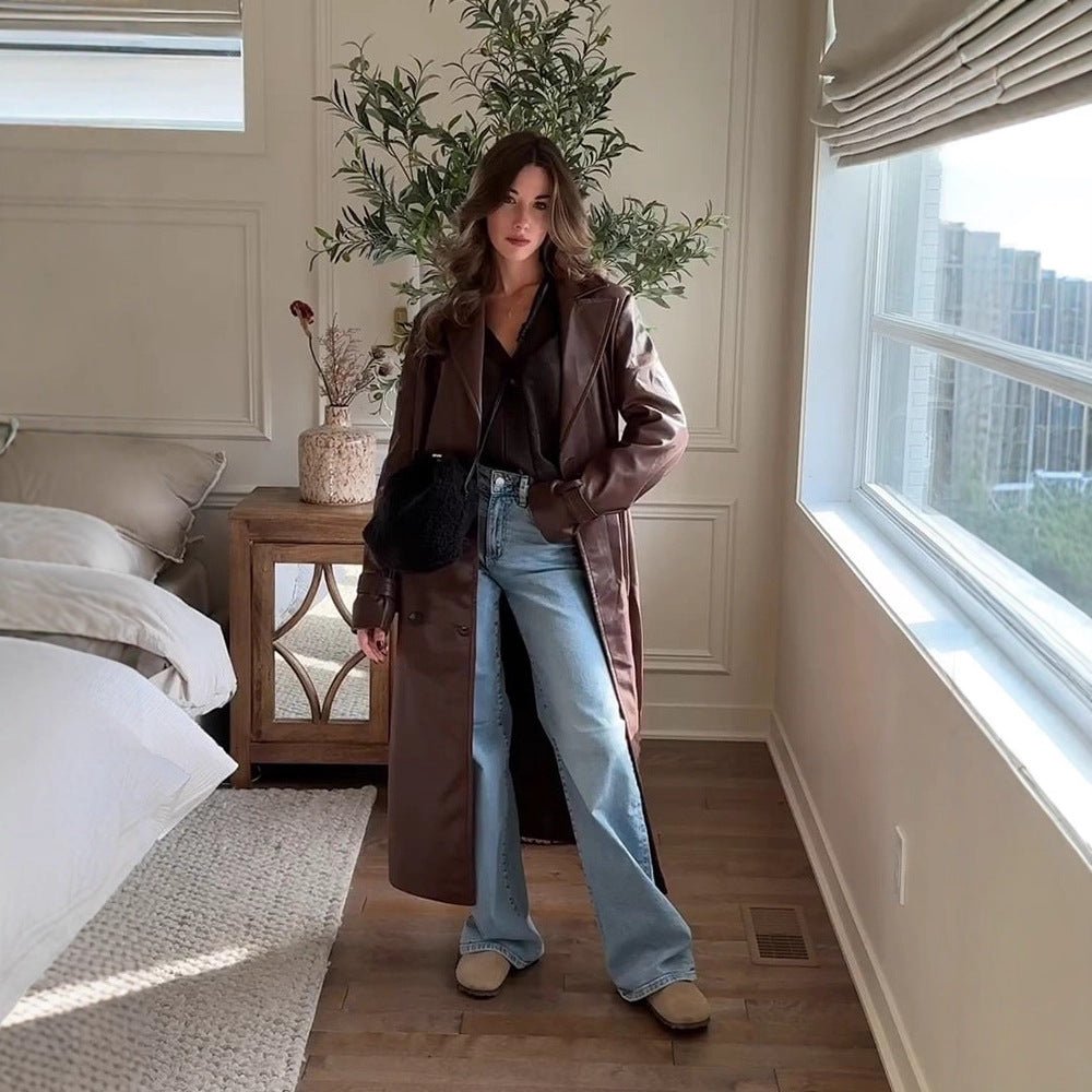 Women Long Trench Coat Made of Faux Leather with Oversized Shoulders and Tailored Silhouette Chichicherry - Chichicherry