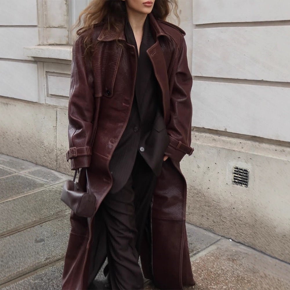 Women Long Trench Coat Made of Faux Leather with Oversized Shoulders and Tailored Silhouette Chichicherry - Chichicherry