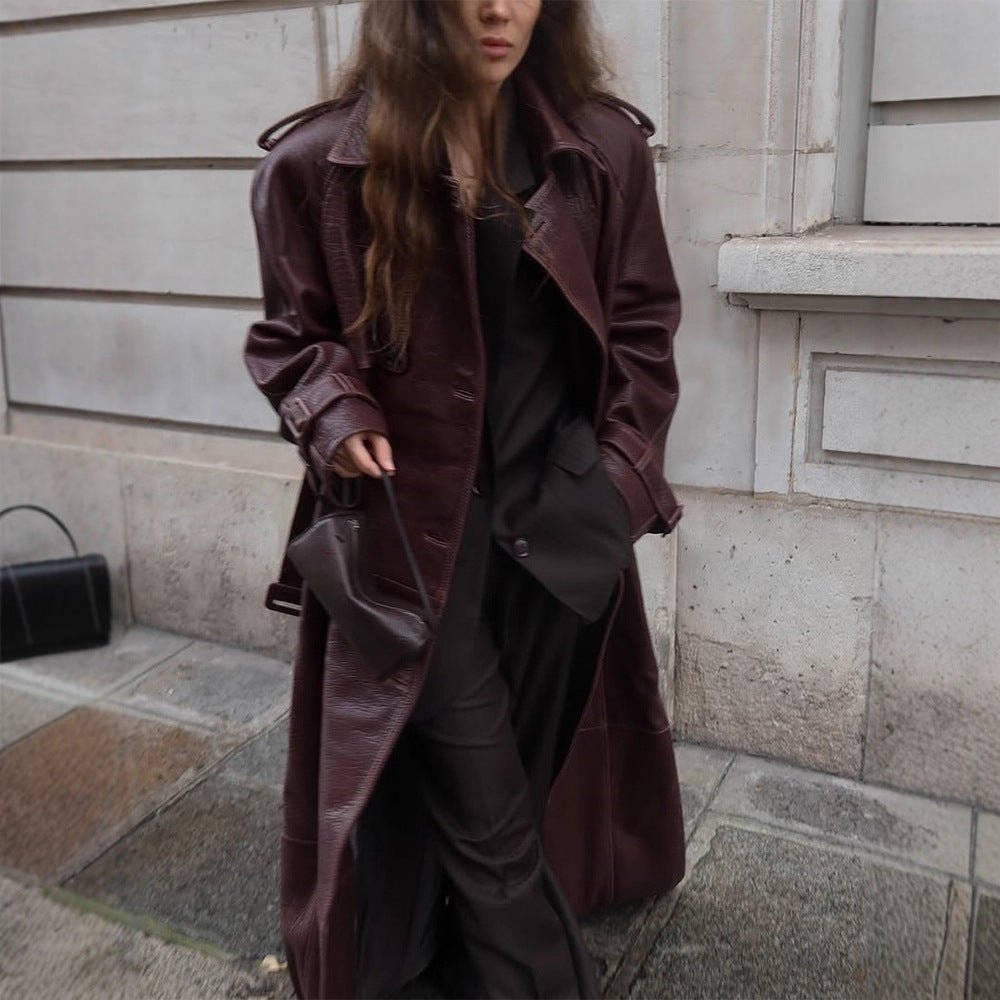 Women Long Trench Coat Made of Faux Leather with Oversized Shoulders and Tailored Silhouette Chichicherry - Chichicherry