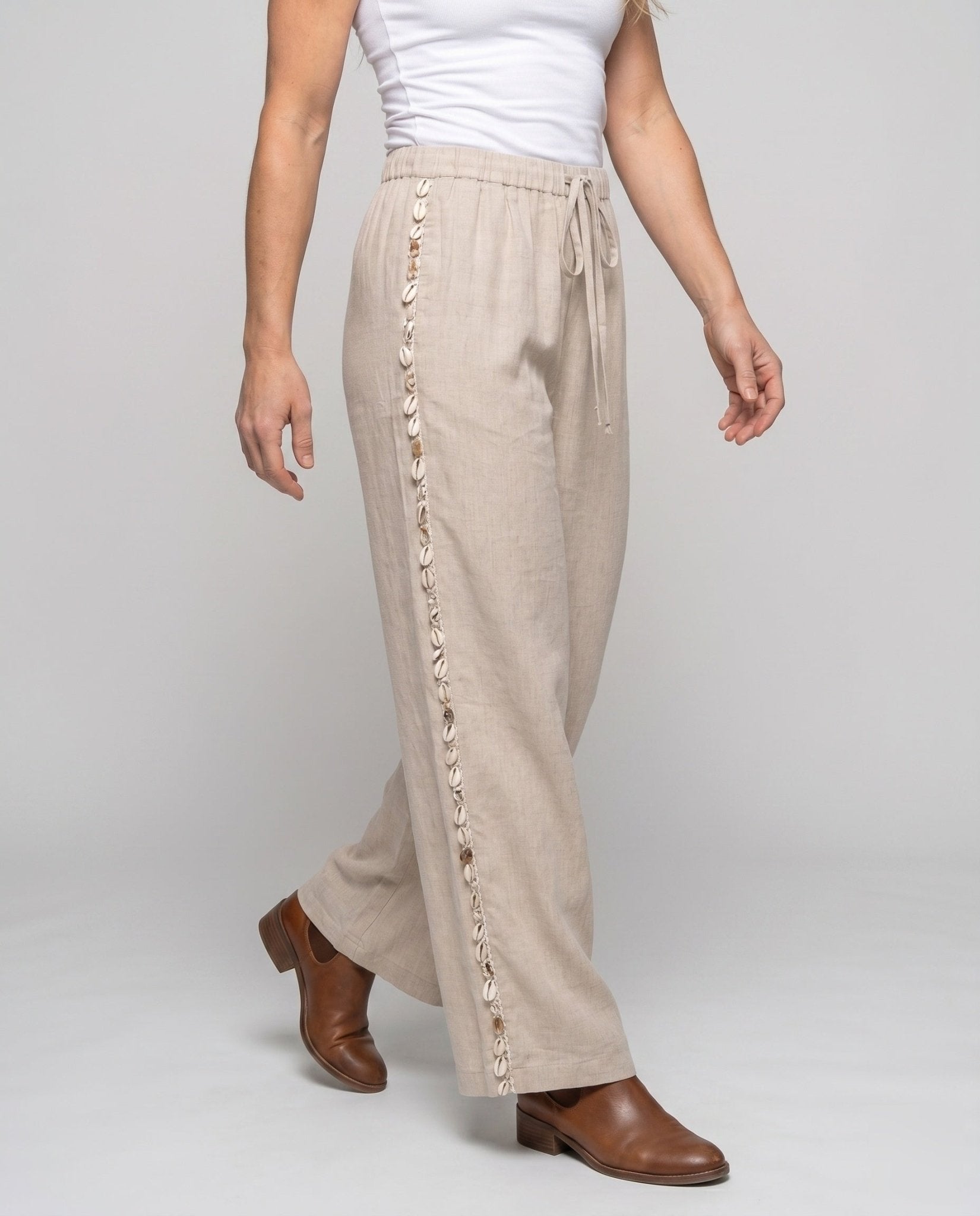 Women's airy linen trousers with high waistband and side ruffles - Chichicherry