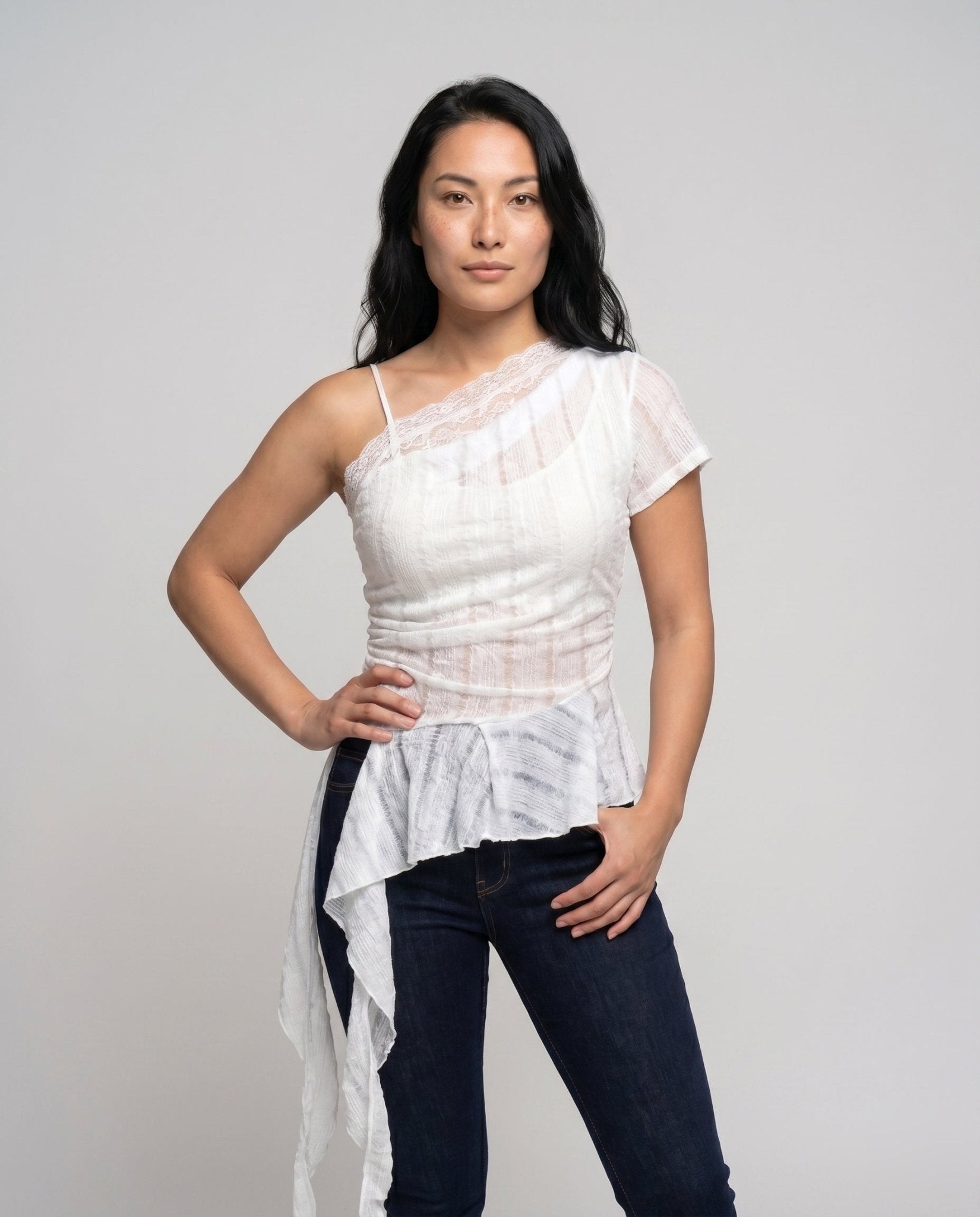 Women's asymmetrical top with stylish ruffle and decorative shoulder strap - Chichicherry