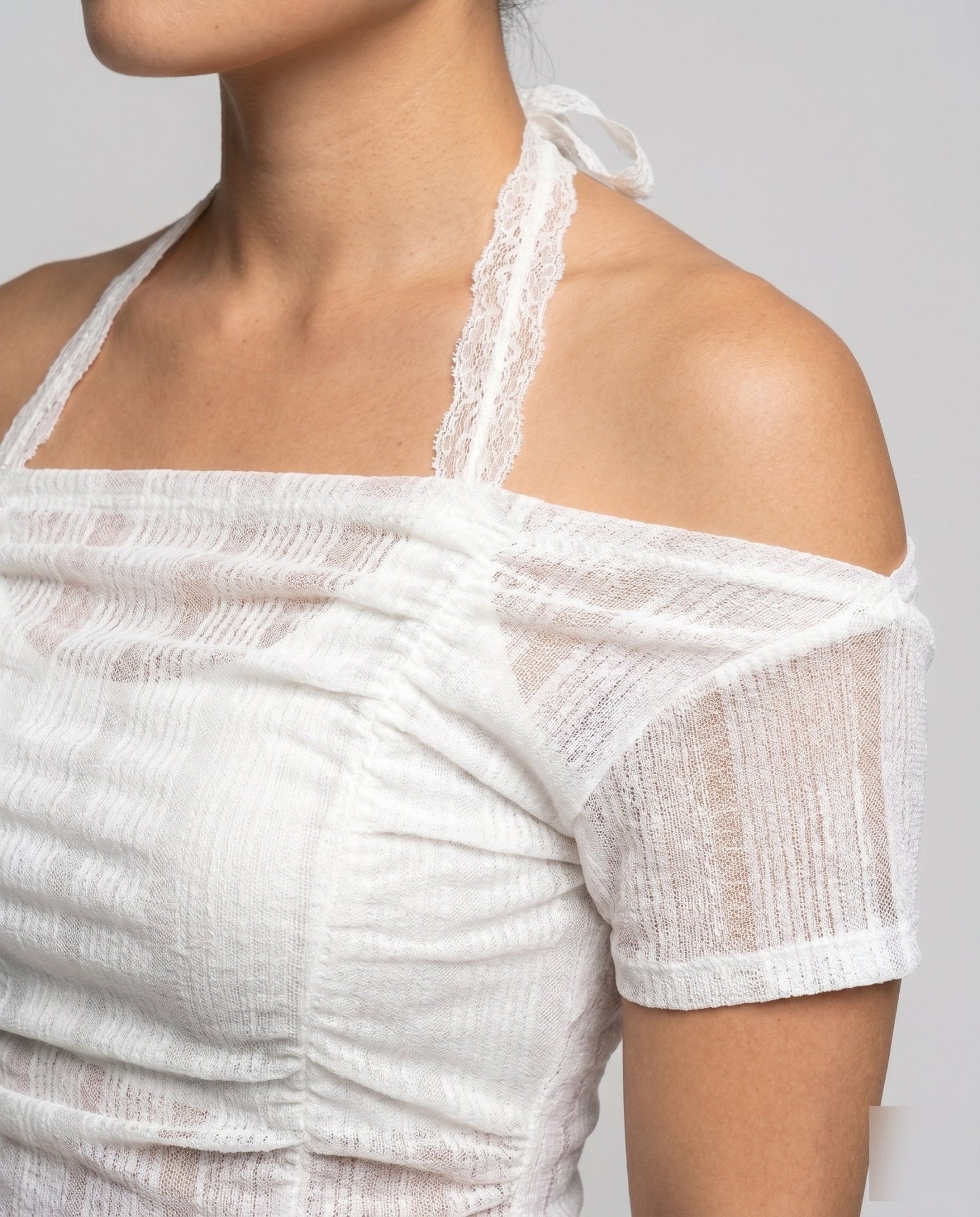 Women's asymmetrical top with stylish ruffle and decorative shoulder strap - Chichicherry