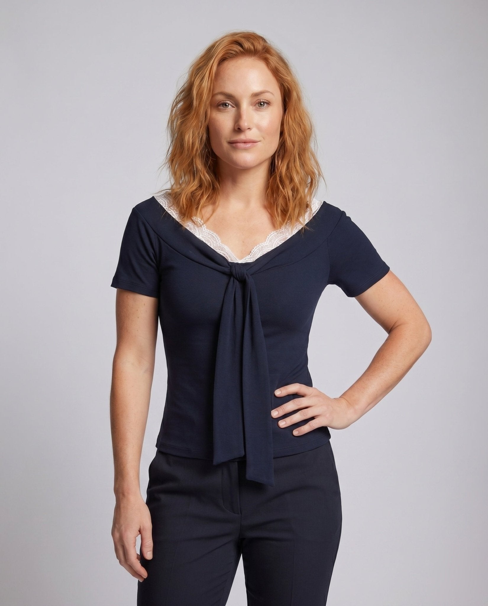 Women's blouse shirt with elegant lace neckline and decorative bow - Chichicherry