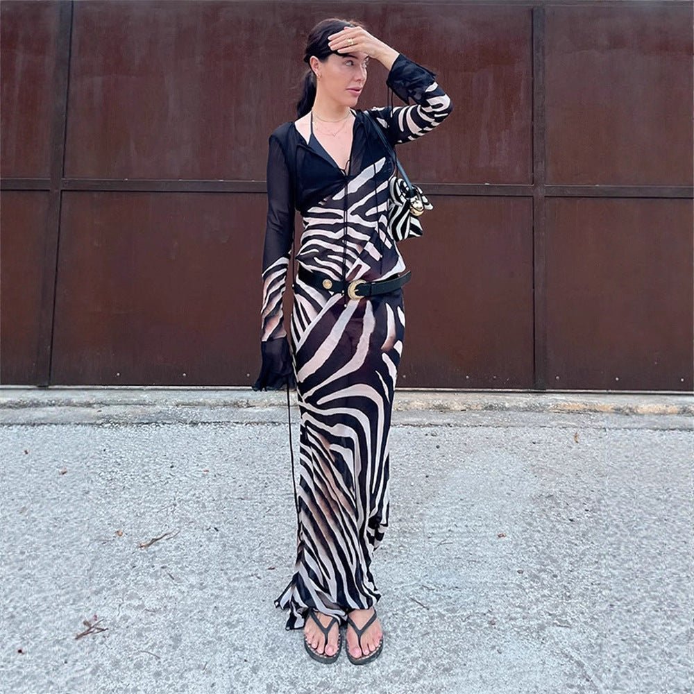 Women's body-hugging mesh maxi dress with deep V-neckline & graphic zebra print Chichicherry - Chichicherry