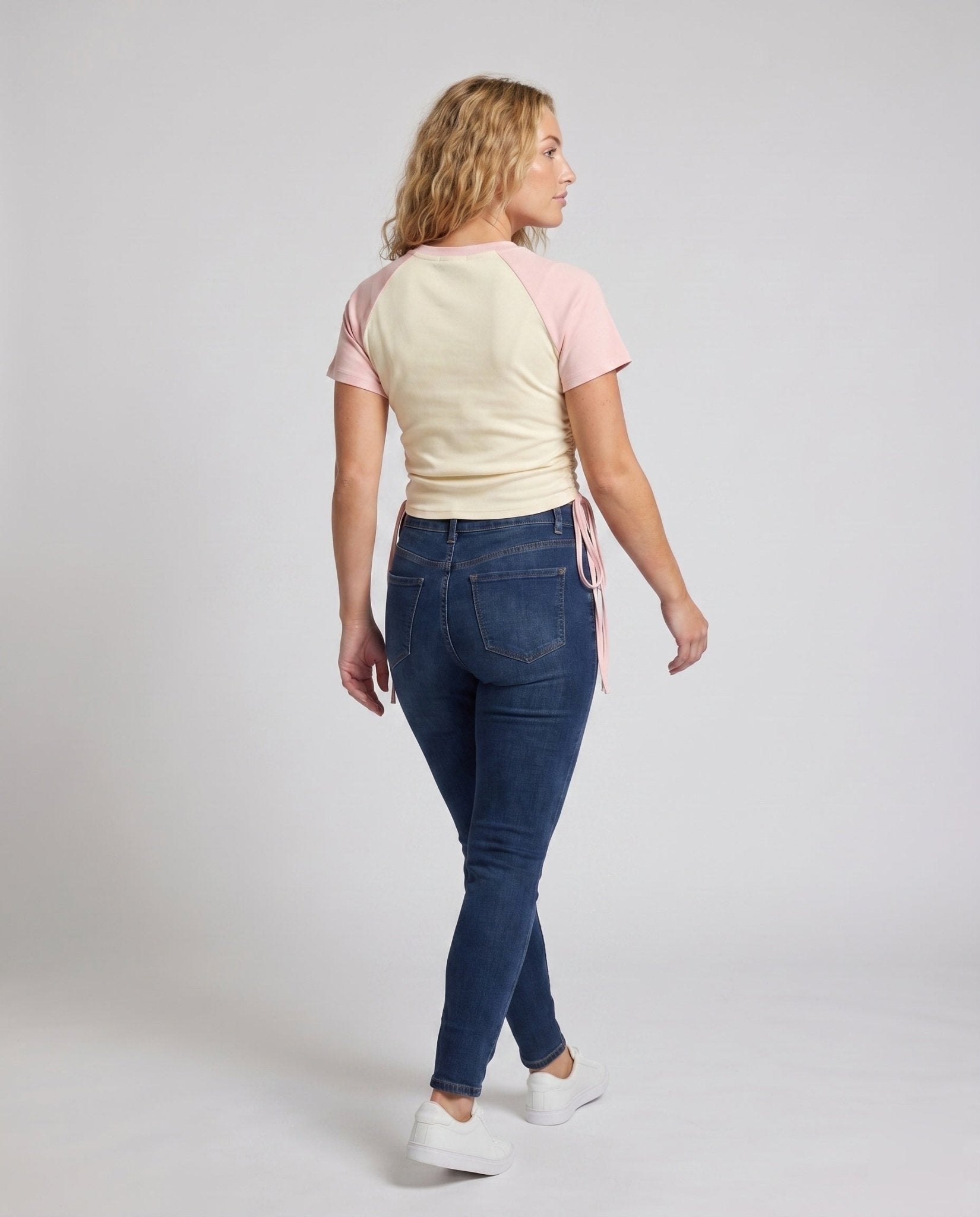 Women’s crop top with playful drawstring waist design and contrasting colored sleeves - Chichicherry