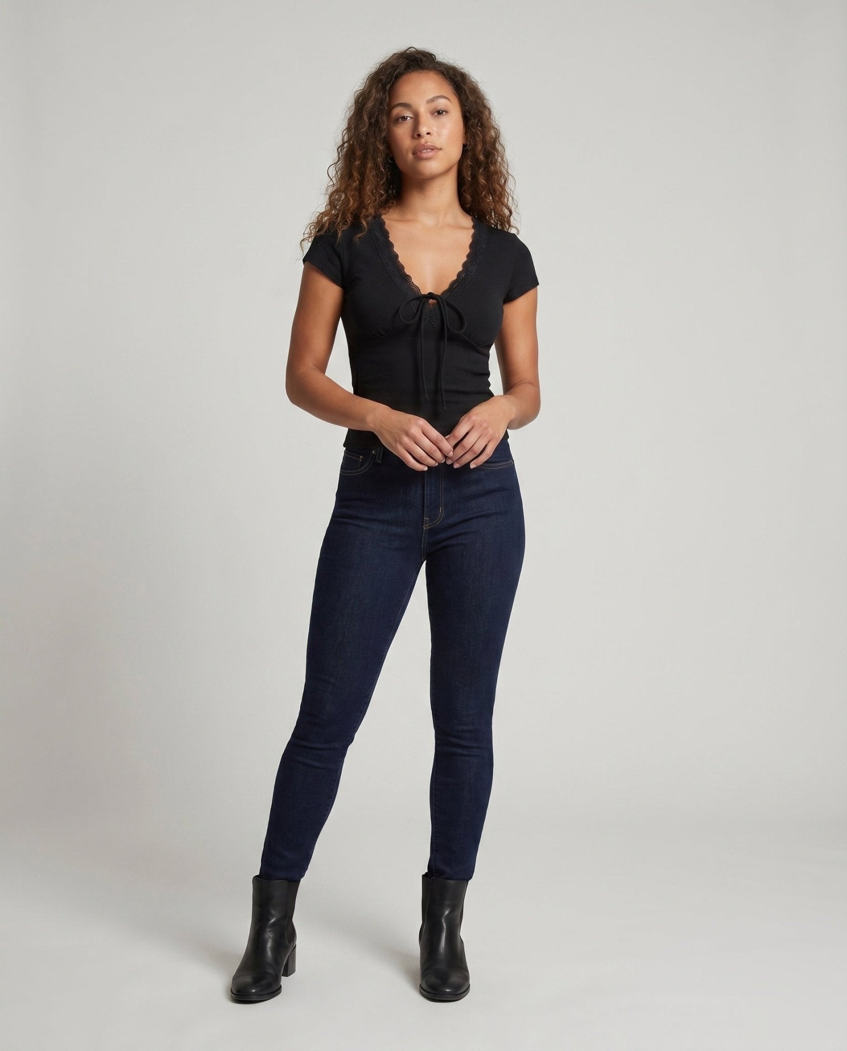 Women's fitted top with playful ruffle detail and charming tie band - Chichicherry