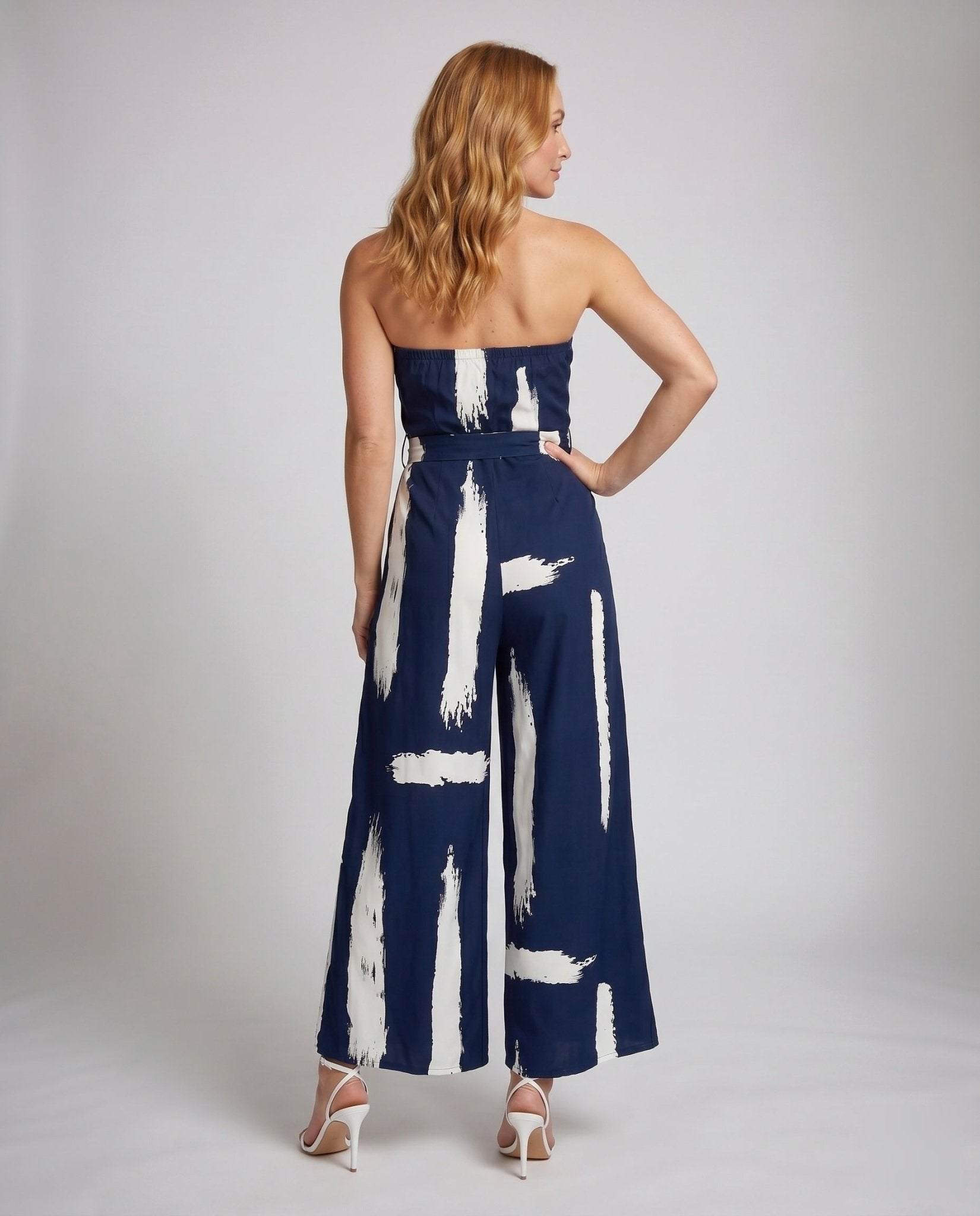 Women's jumpsuit with strapless design and stylish tie belt - Chichicherry