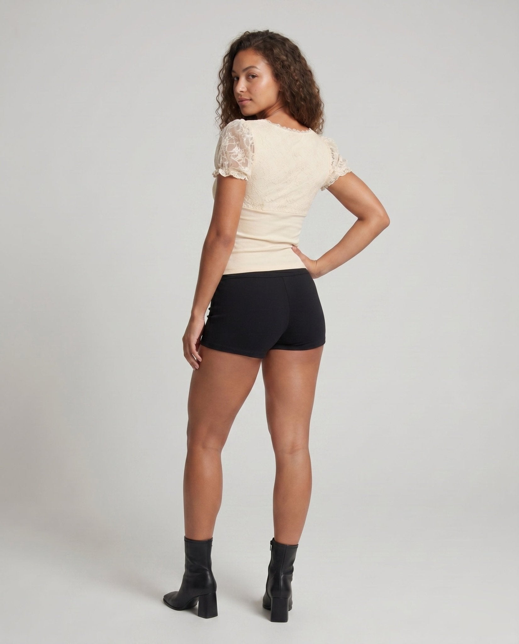 Women's lace top with voluminous ruffle hems and elegant waistband - Chichicherry