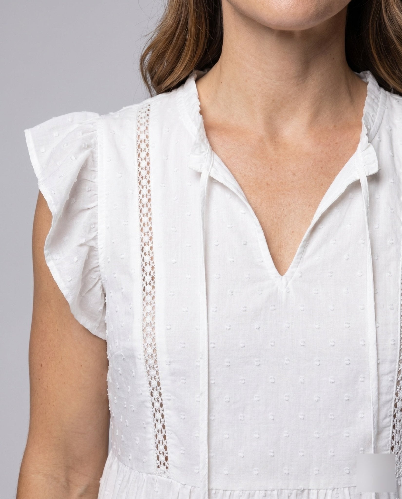Women's lightweight blouse with ruffle details and decorative button accents - Chichicherry