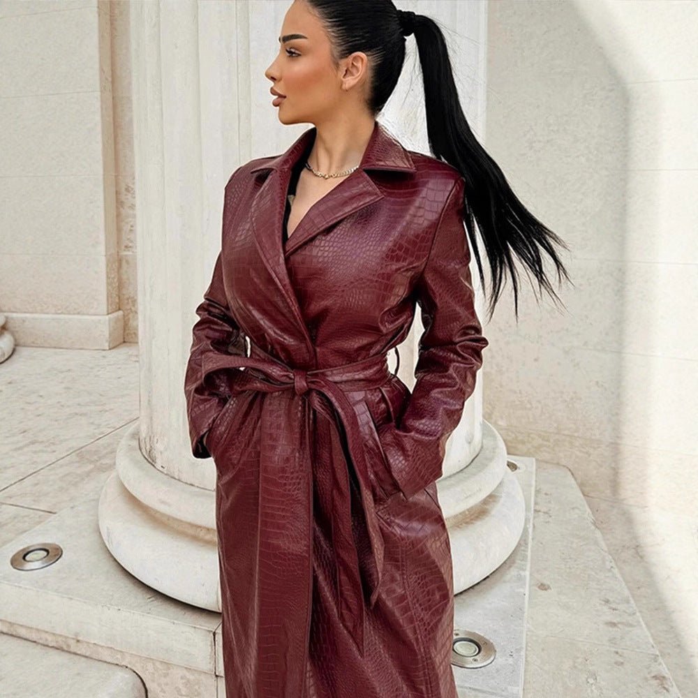 Women's long coat made of faux leather with crocodile embossing and waist belt Chichicherry - Chichicherry