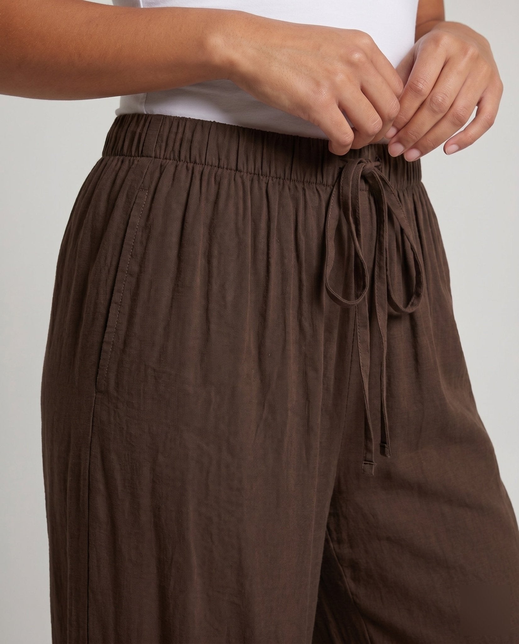 Women's loosely cut palazzo pants with elastic waistband and tie belt - Chichicherry