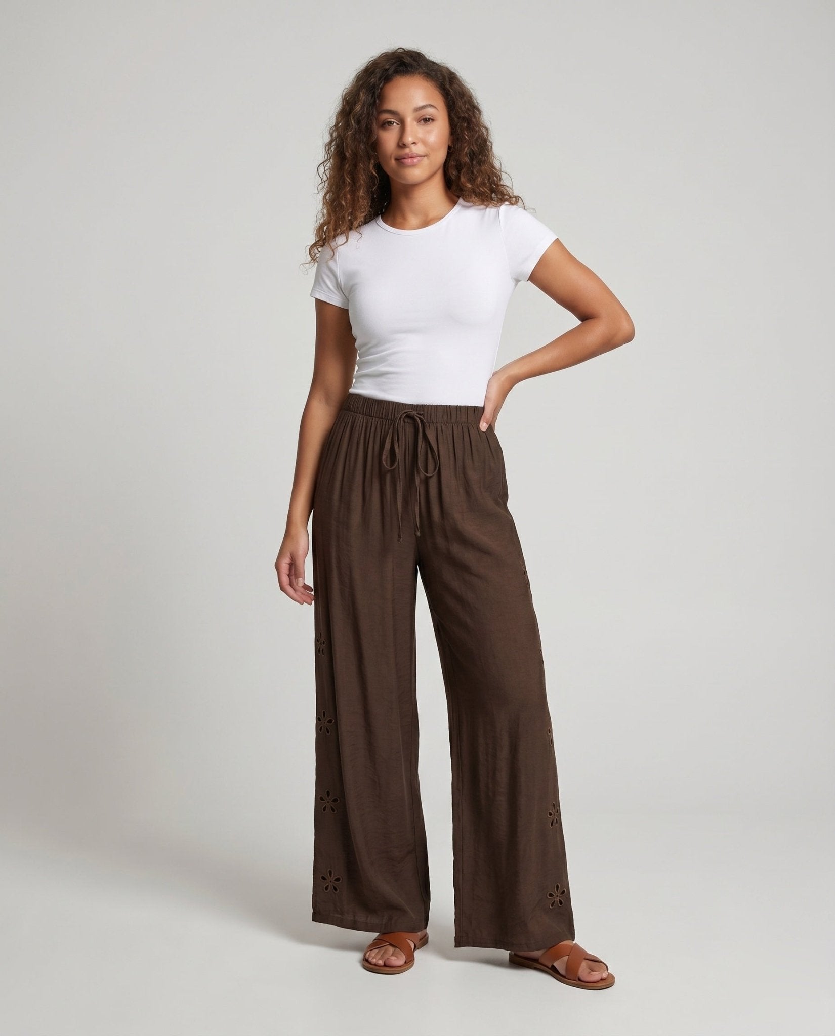 Women's loosely cut palazzo pants with elastic waistband and tie belt - Chichicherry