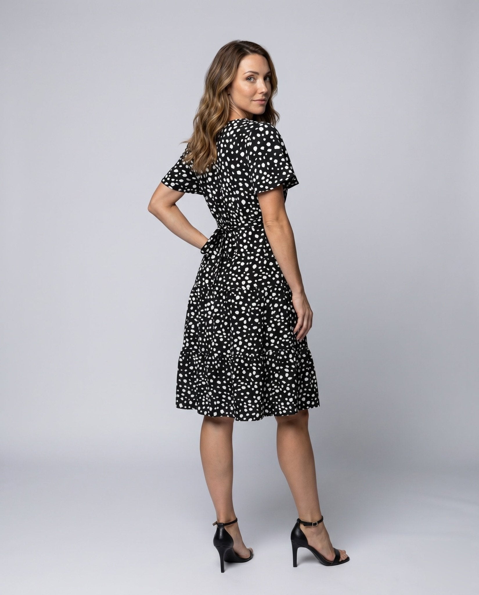 Women's midi dress with flowing skirt and decorative polka dot pattern - Chichicherry