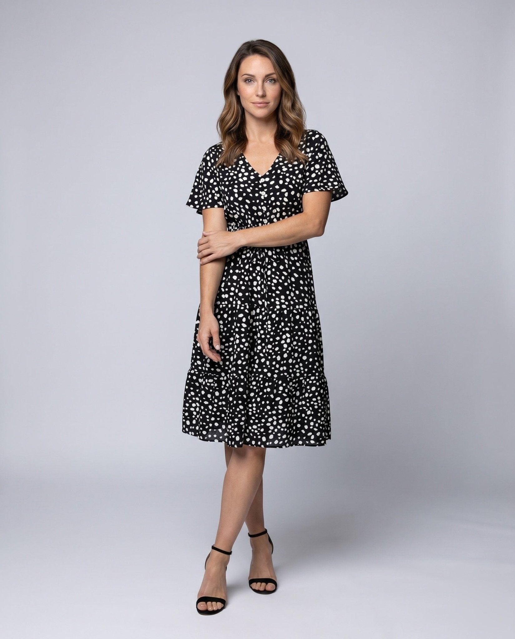 Women's midi dress with flowing skirt and decorative polka dot pattern - Chichicherry