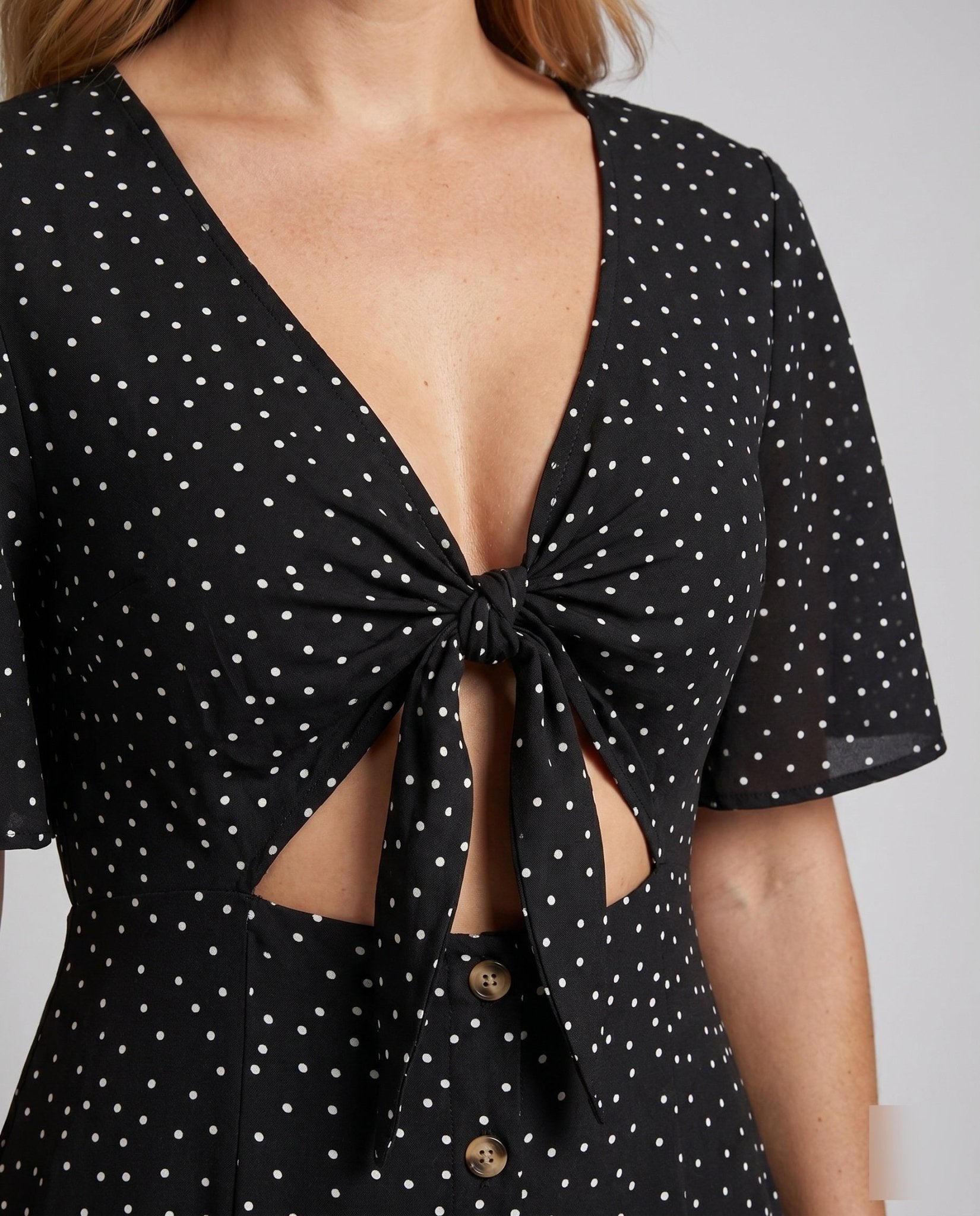 Women's midi dress with playful button details and elegant V-neckline - Chichicherry