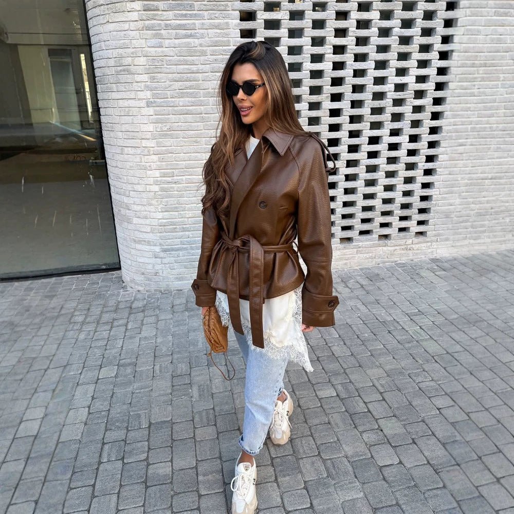 Women’s short cut oversized faux leather trench coat with waist belt and epaulettes Chichicherry - Chichicherry