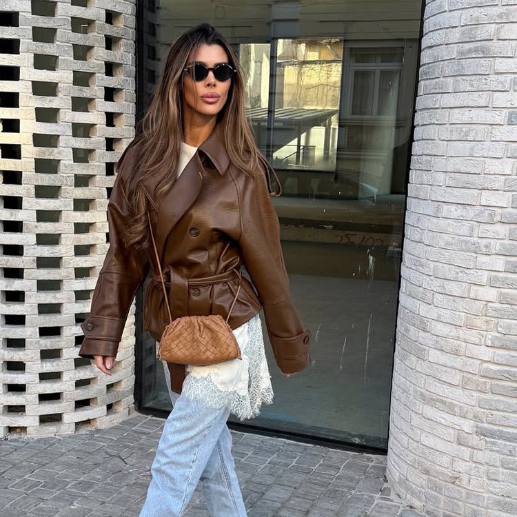Women’s short cut oversized faux leather trench coat with waist belt and epaulettes Chichicherry - Chichicherry