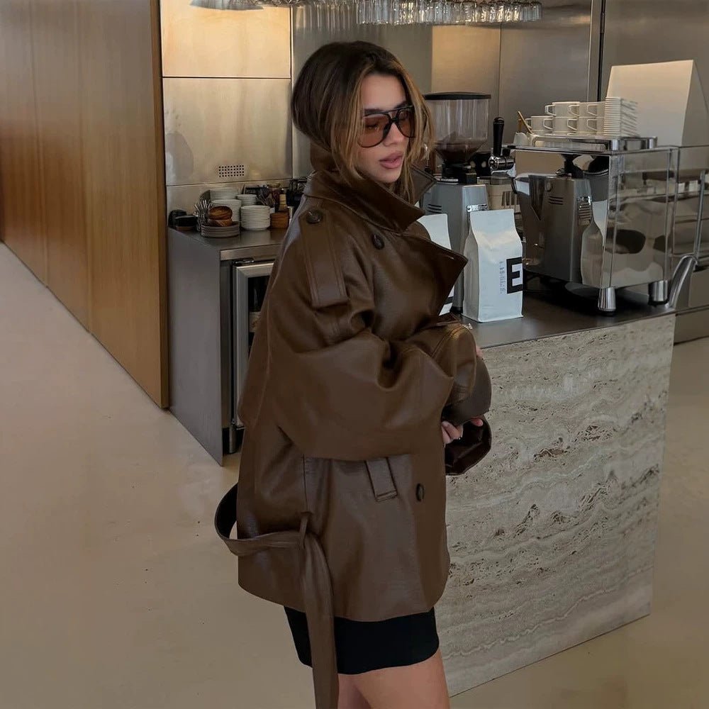 Women’s short cut oversized faux leather trench coat with waist belt and epaulettes Chichicherry - Chichicherry