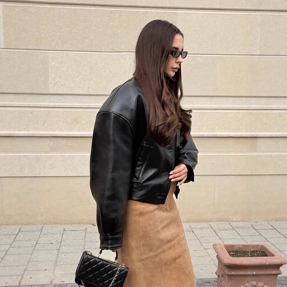 Women's short jacket made of vegan leather imitation in boxy cut with oversized shoulders and hidden button placket Chichicherry - Chichicherry