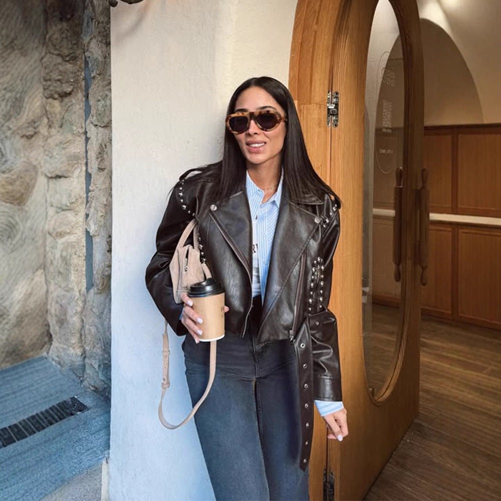 Women's Short Studded Biker Jacket Made of Faux Leather with Waist Belt Chichicherry - Chichicherry
