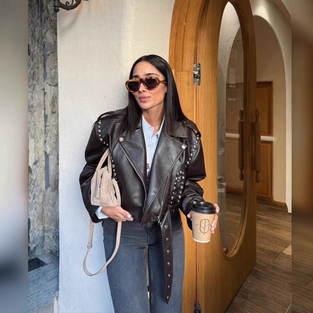 Women's Short Studded Biker Jacket Made of Faux Leather with Waist Belt Chichicherry - Chichicherry
