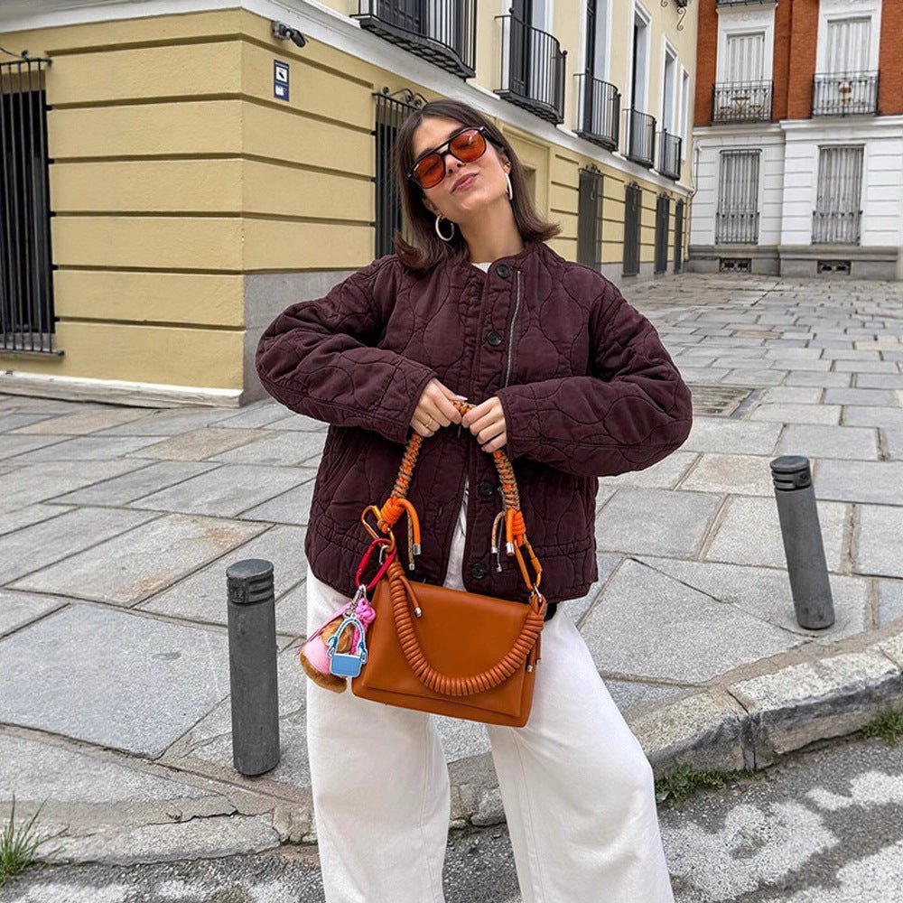 Women's shoulder bag made of synthetic leather with braided handle and spiral-shaped front grip Chichicherry - Chichicherry