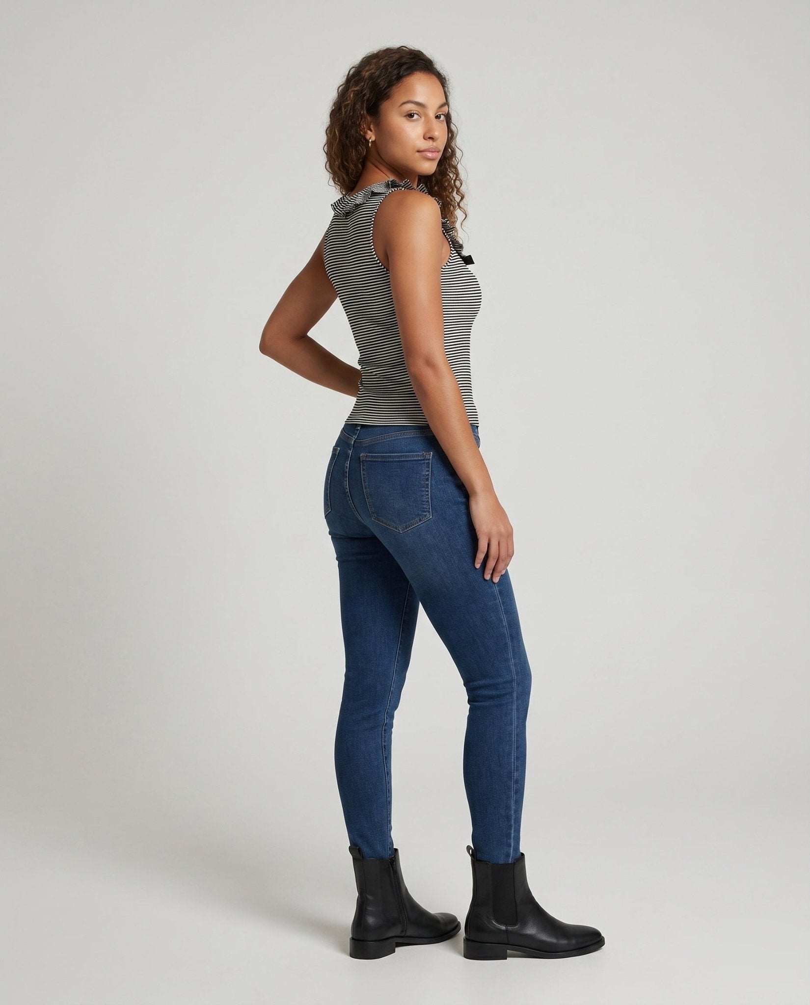 Women's sleeveless top with playful ruffle design and fine stripes - Chichicherry