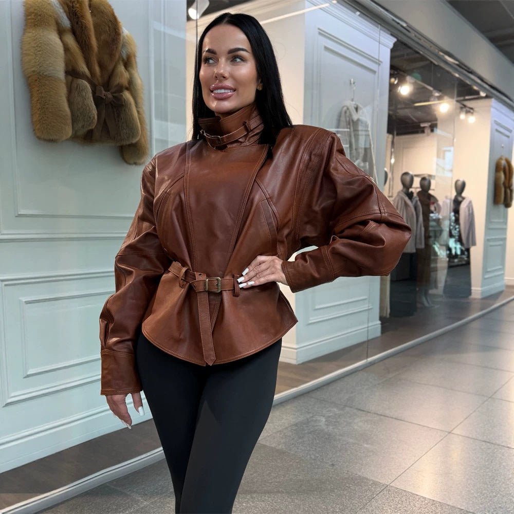 Women's tailored faux leather jacket with standing collar, neck strap, and figure-shaping waist belt Chichicherry - Chichicherry