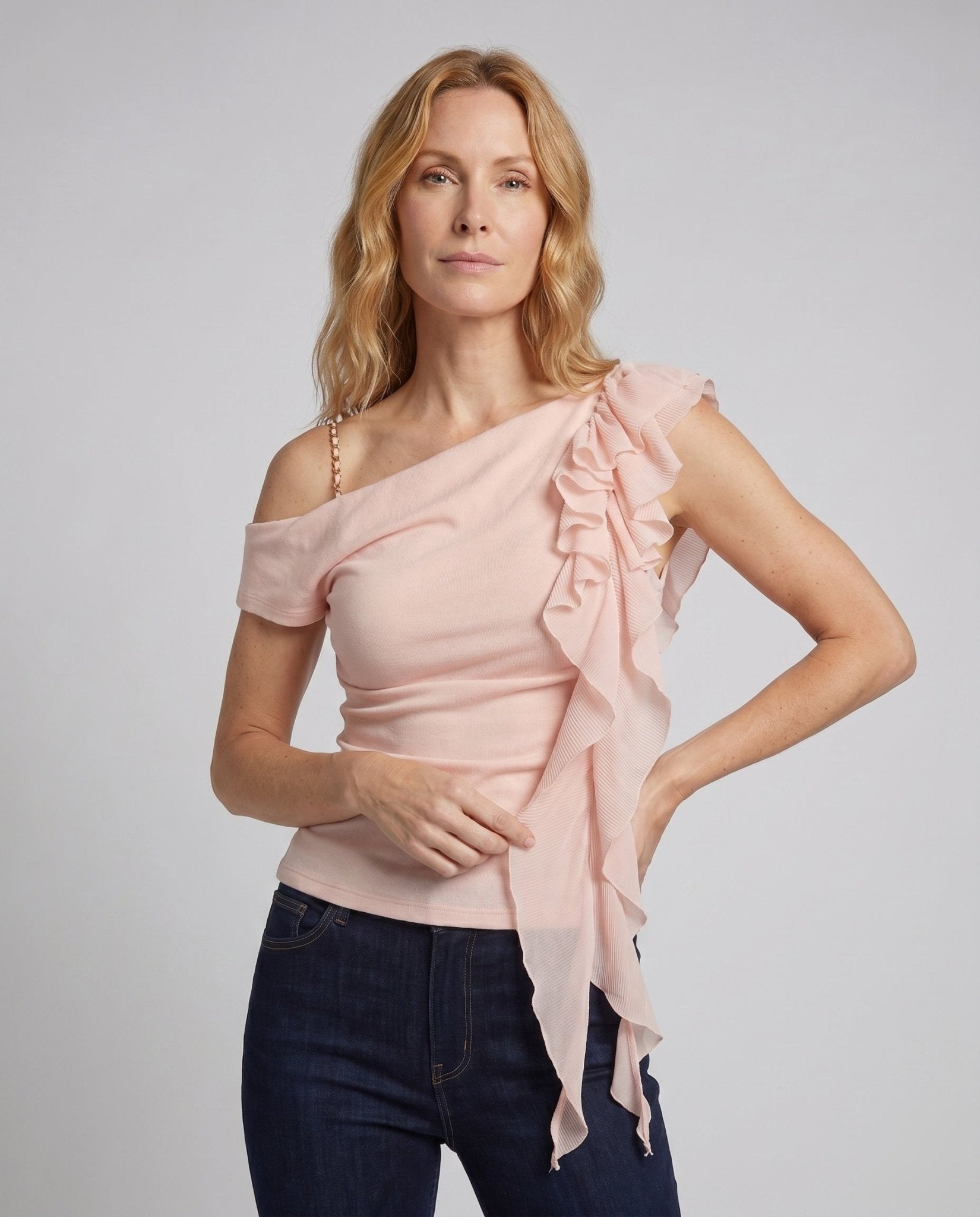 Women’s top with asymmetric neckline and flowing ruffles - Chichicherry