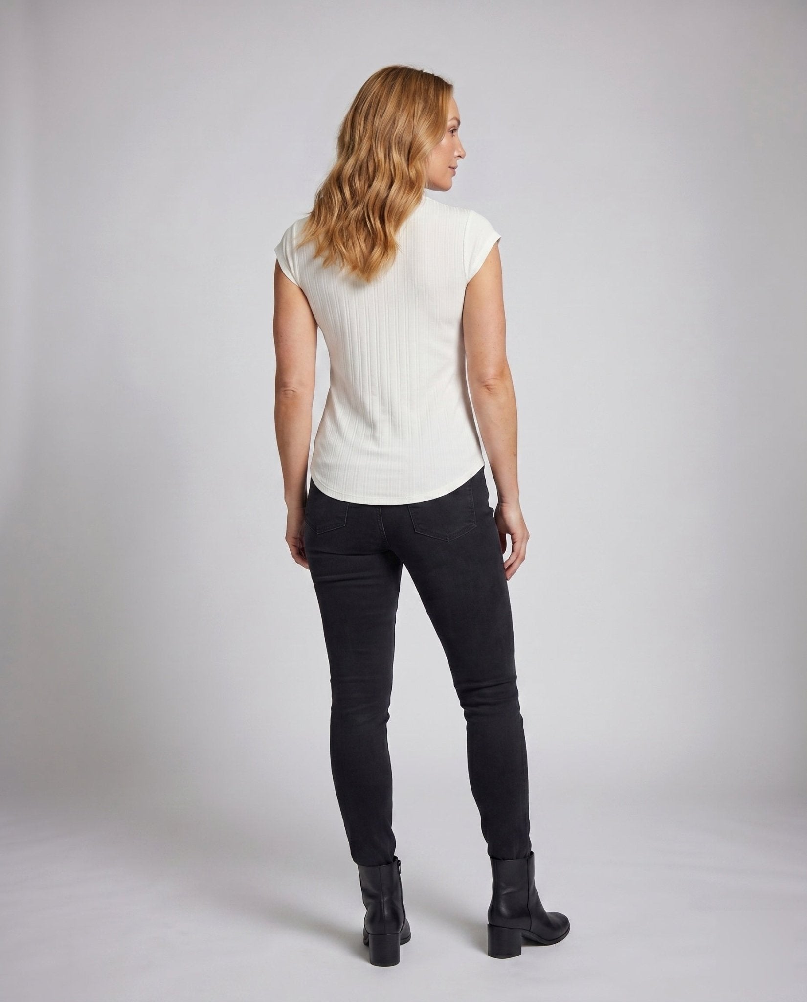Women's top with decorative bow neckline and figure-flattering design - Chichicherry